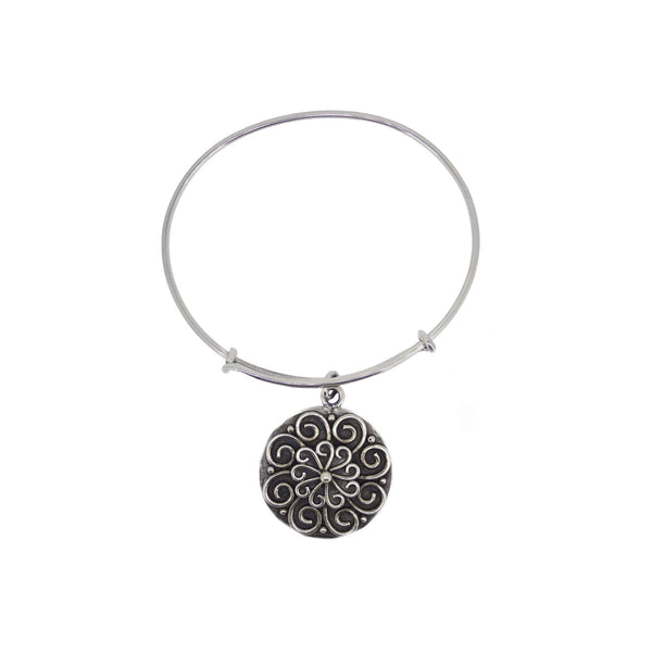 white box photo of charm bracelet with scroll work 