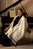 on model shot of creamy white scarf with fringe