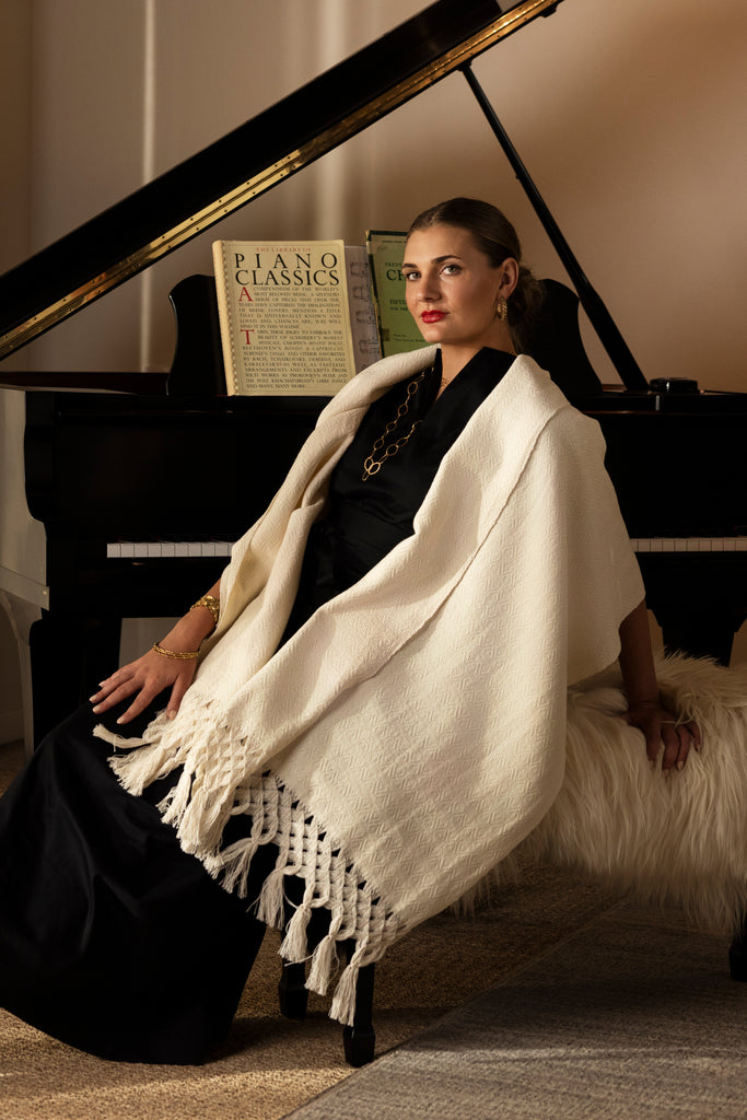 on model shot of creamy white scarf with fringe