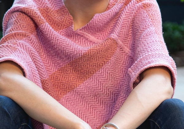 close up of alternating pattern of pink mananita poncho 