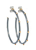 close up view of sterling silver Lluvia earrings with 14k gold stationed beading 