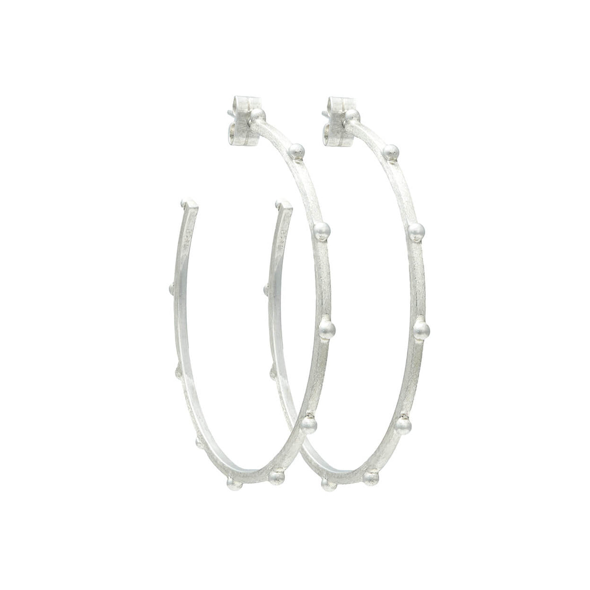 Sterling Silver earrings close up shot of textured finish and raised beading 