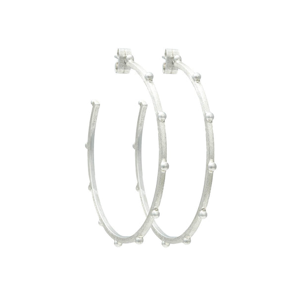 Sterling Silver earrings close up shot of textured finish and raised beading 
