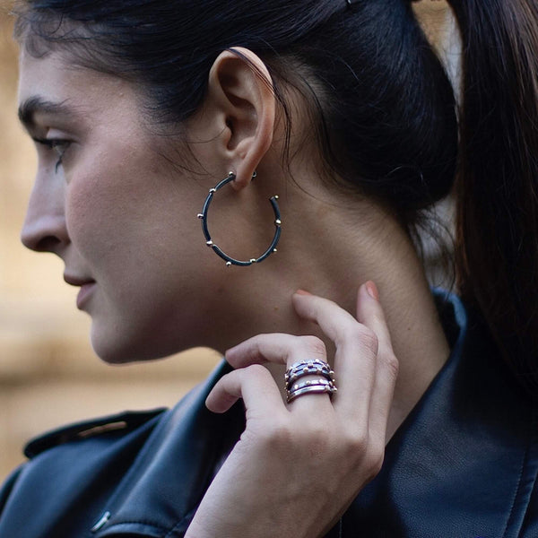 model with sterling silver hoop earrings oxidized silver with 14k gold details LLuvia collection Cornelia Lively 