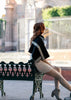 on model looking at cathedral black scarf